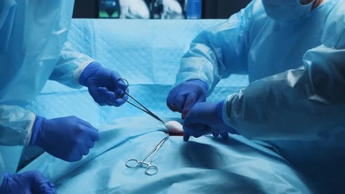 Surgeons Performing Surgery in Operating Room