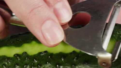 Cucumber being Peeled in Close-up