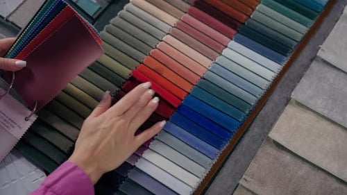 Woman Selecting Fabric Samples in Design Studio