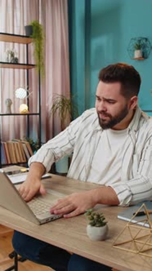 Displeased Sad Businessman Using Laptop Loss Game Fail Computer Virus Error Bad News at Home Office