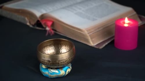Tibetan brass bell holy spiritual book and red candle