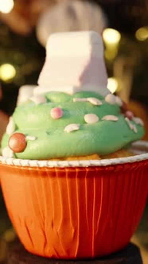 Vertical video. Brushing Gold Dust on a Tree-Shaped Cookie, Ensuring Every Detail Shines