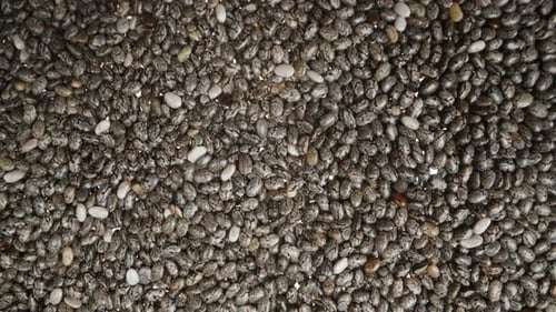 Chia seeds, top view, close-up. Slider shot.