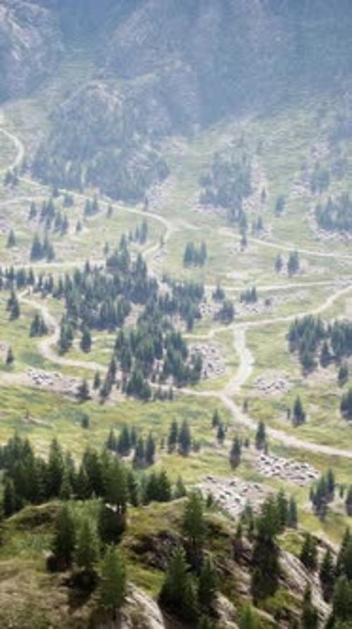 A Serpentine Mountain Road Surrounded By Breathtaking Scenery
