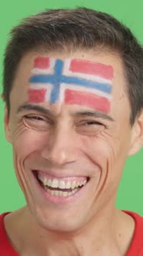 Man Smiling with Flag Painted on Forehead