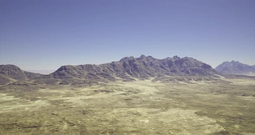 Breathtaking View of Rugged Mountain Landscape Under Clear Blue Sky