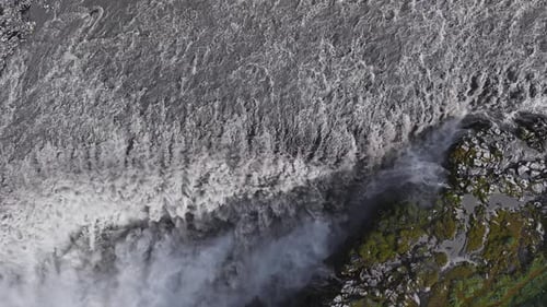 Aerial View of Dettifoss Waterfall with Cascading Water and Mist