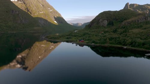 Lofoten island traditional red house. Norway Scandinavia nature with sea, fjord, mountains and water