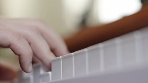 Close Up View Below of Male Hands of Pianist Playing Various Chords, Composing Music Concept.