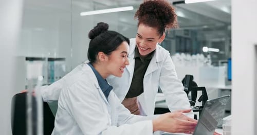 Smiling Scientists Collaborating in a Bright Laboratory