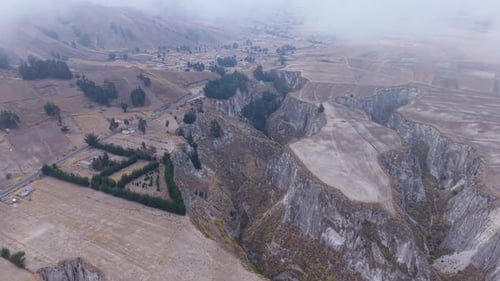 Deep Canyon Cutting Through Rugged Ecuador Landscape Winding Road Nestled Village Mountain Terrain