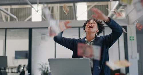 Excited Woman Celebrates as Money Rains Down