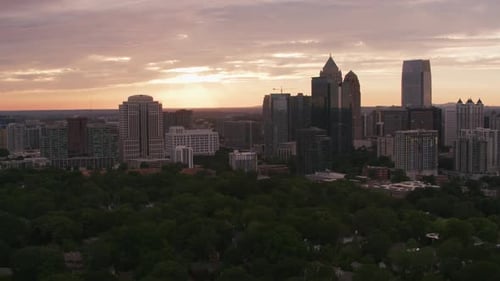 Sunset Over Modern City Skyline With Peaceful Evening Glow
