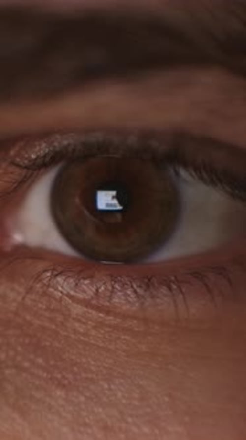 Slow Cinematic Transition of a Human Eye Gently Opening From Closed Eyelid to Revealed Iris and