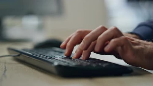Business hands typing on keyboard at office workplace for corporate report