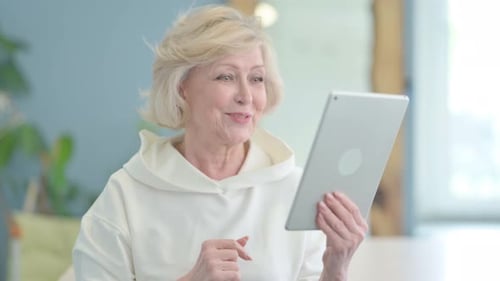 Senior Woman Video Calling on Tablet Device