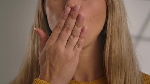Woman Blowing Kiss Towards Camera in Close Up