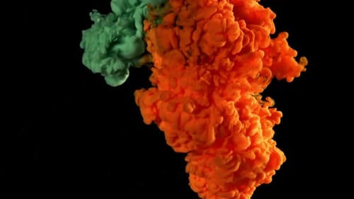 Green and Orange Paints in Water on a Black Background Filmed on a Highspeed Camera at 1000 Fps