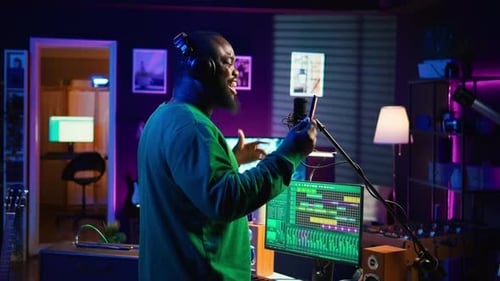 Young Artist Singing His New Song Creation on Microphone Gear