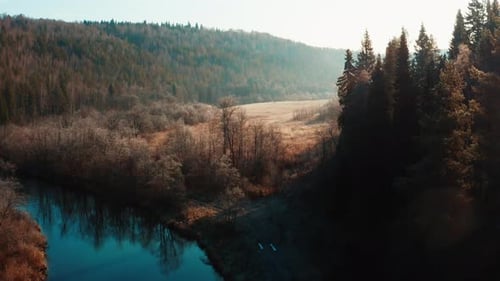 Aerial view of the blue river at sunrise