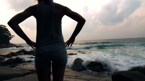 Woman Watching Ocean Waves in Slow Motion