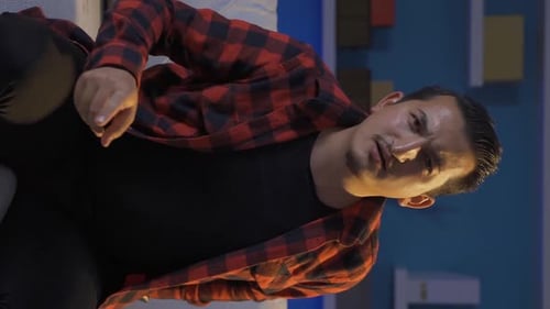 Man Speaking Assertively, Gesturing to Camera