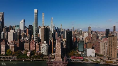 Aerial Views Capture a Forward Glide Over the Queensboro Bridge Showcasing Manhattan Skyscrapers and