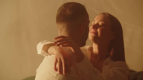 Loving Couple Embracing Indoors