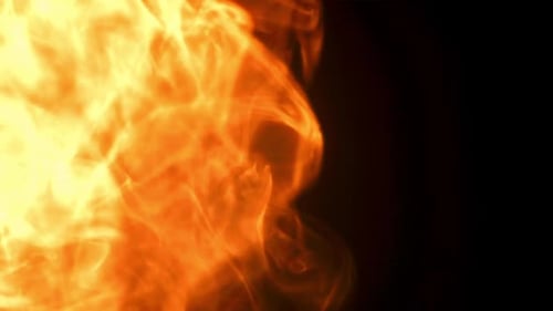 Burning fire with black background, slow moving flames