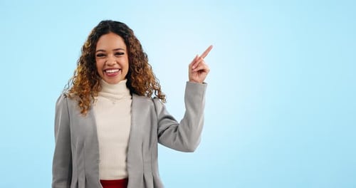 Happy business woman, pointing and list in advertising, marketing or mockup against a blue studio