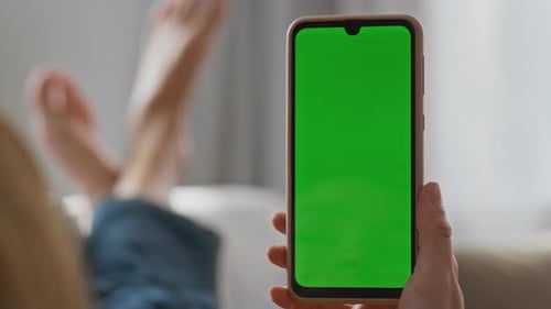 Closeup Hands Holding Chromakey Cellphone at Home Unknown Woman Watching Phone