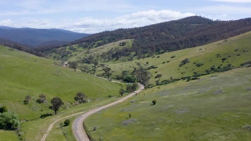 Aerial View of Winding Road in Green Hills