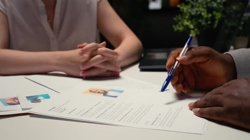 Close Up of a CV Resume on the Table During Detailed Job Interview