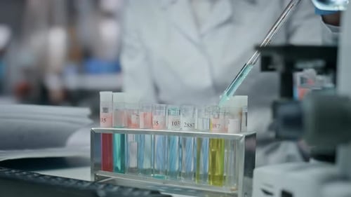 Scientist Hand Using Pipette Filling Test Tube Conducting Experiment Close Up