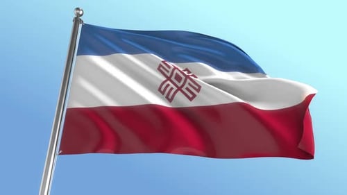 Waving Flag of the Mari El Republic against Blue Sky
