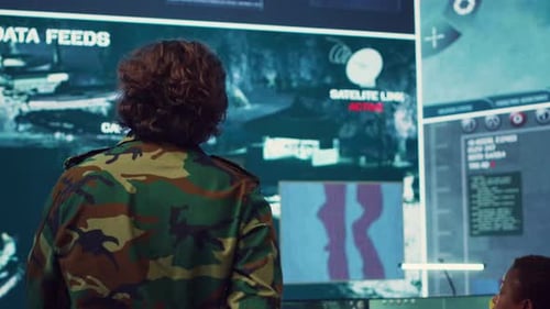 Man Explaining Satellite Data in High-Tech Office