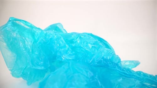 Blue plastic bags macro on white background isolated 4K