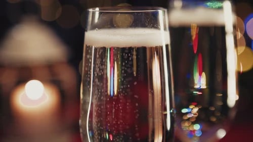 Sparkling Champagne Glasses Reflecting Festive Lights