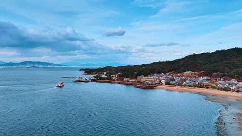 Approaching the shore of the Seto Inland Sea with picturesque houses and beautiful nature.