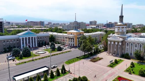 Aerial View of Bishkek City Hall with Mountain Background