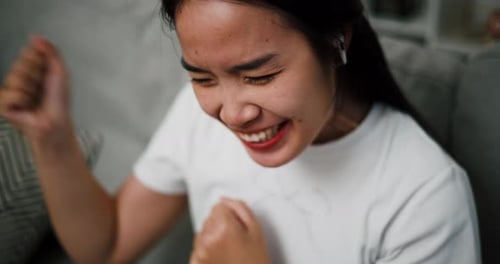 Woman Reacts Emotionally, Crying then Laughing