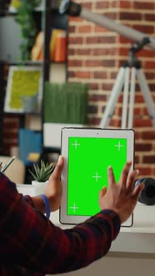 Vertical Video Office Employee Analyzing Digital Tablet with Greenscreen Display