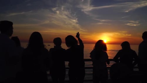 People watching the sunset at Santa Monica pier.