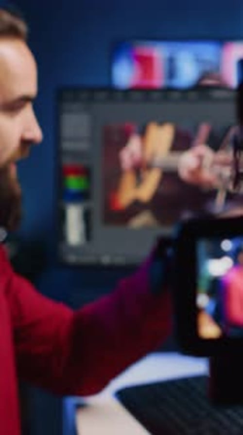 Man Recording Video at Computer Workstation