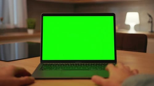 Footage of Computer Green Screen Shot of Unrecognizable Caucasian Man Typing on Keyboard of Laptop