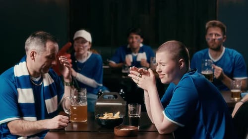 Sports Fans React to Loss at Bar