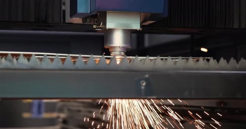 Precision Laser Cutting Metal with Sparks in Factory