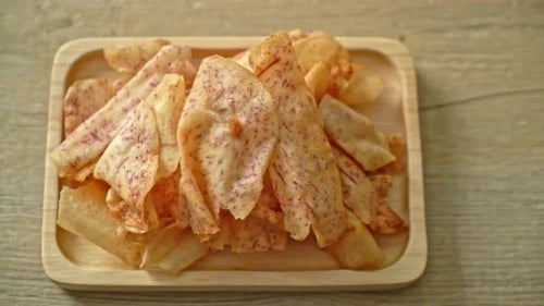 Crispy Taro Chips on Wooden Plate