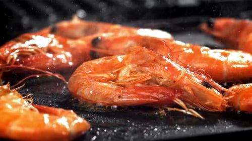 A Sizzling Cinematic Close Up of Fresh Red Shrimp Grilling to Perfection