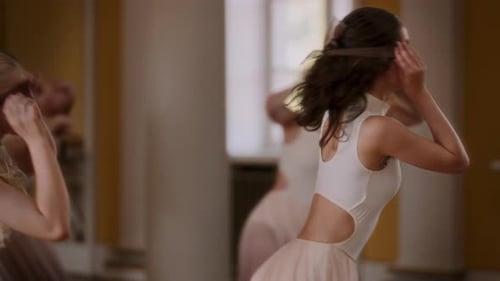 Young Female Dancers Removing Sheer Blindfolds During Dance Routine